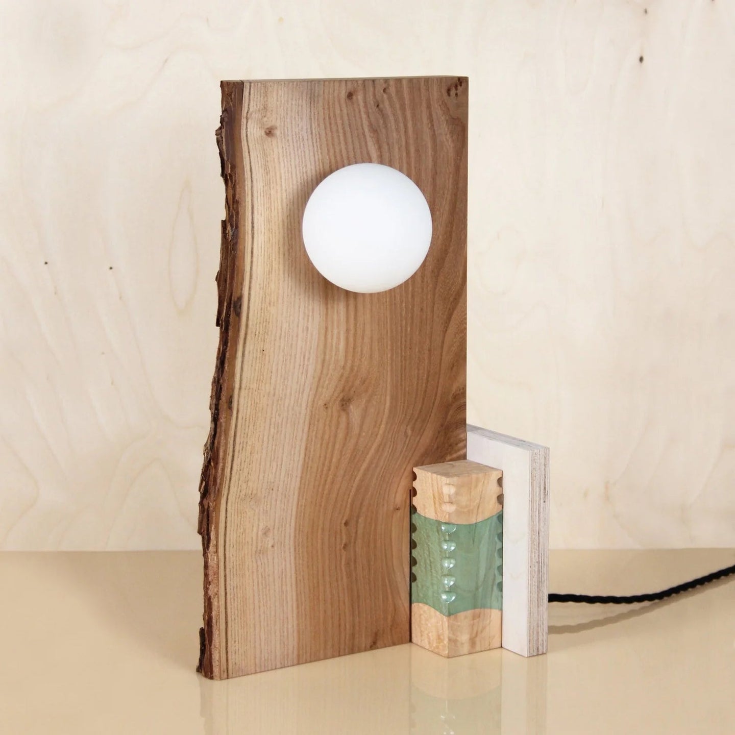 joining-bottles-wood-slice-lamp-wood-offcuts-plastic-bottles-micaella-pedros-the_home_of_sustainable_things